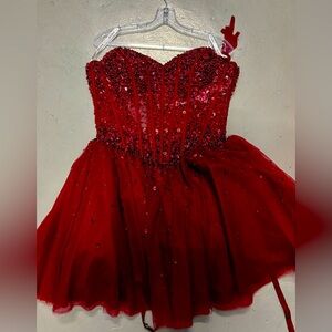 Brand new burgundy strapless dress with tags tie back beaded a size 8